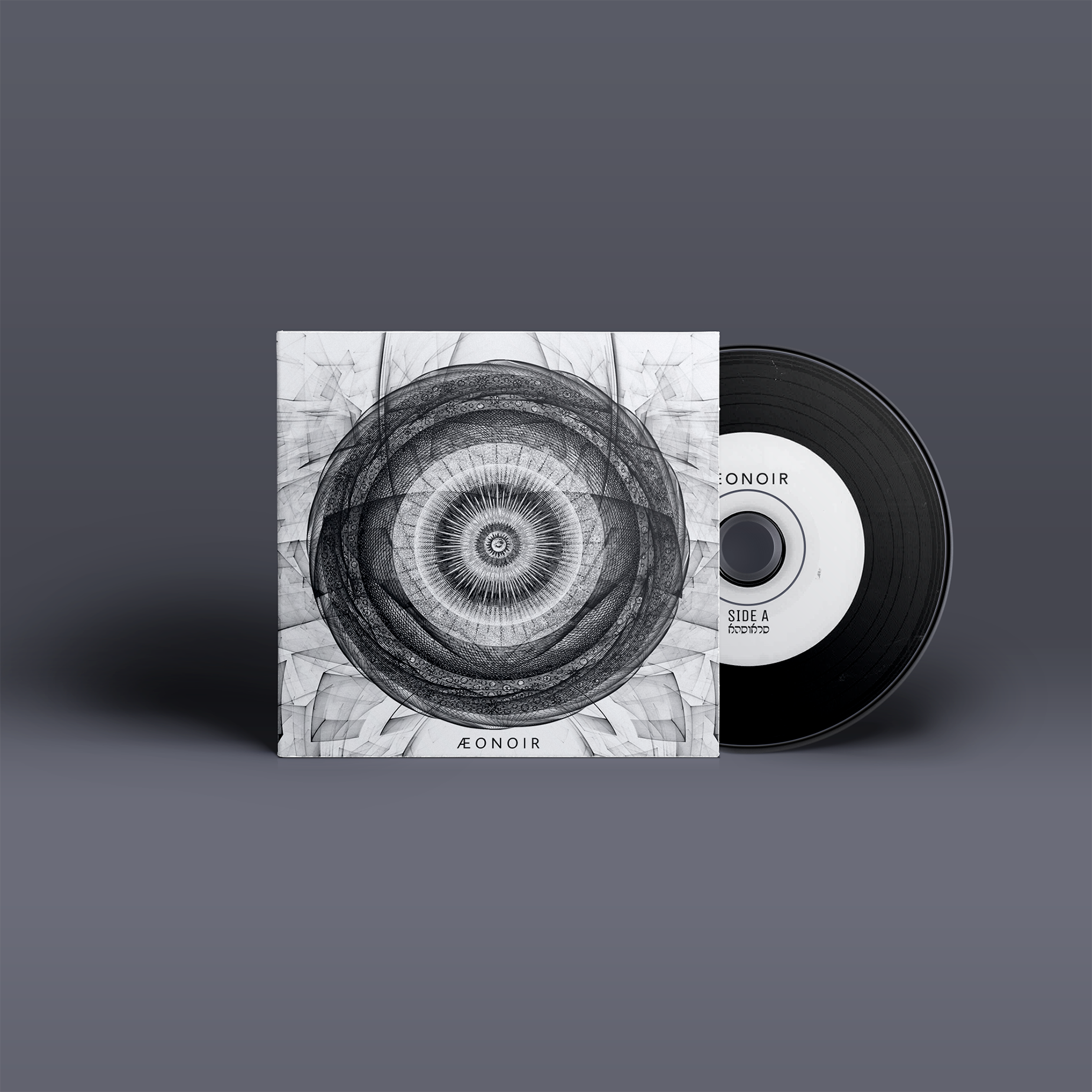 "Ænoir" von "Æshma Dæva" auf CD. Graues Cover mit rundem, schwarzem Motiv, CD in Vinyl-Optik.