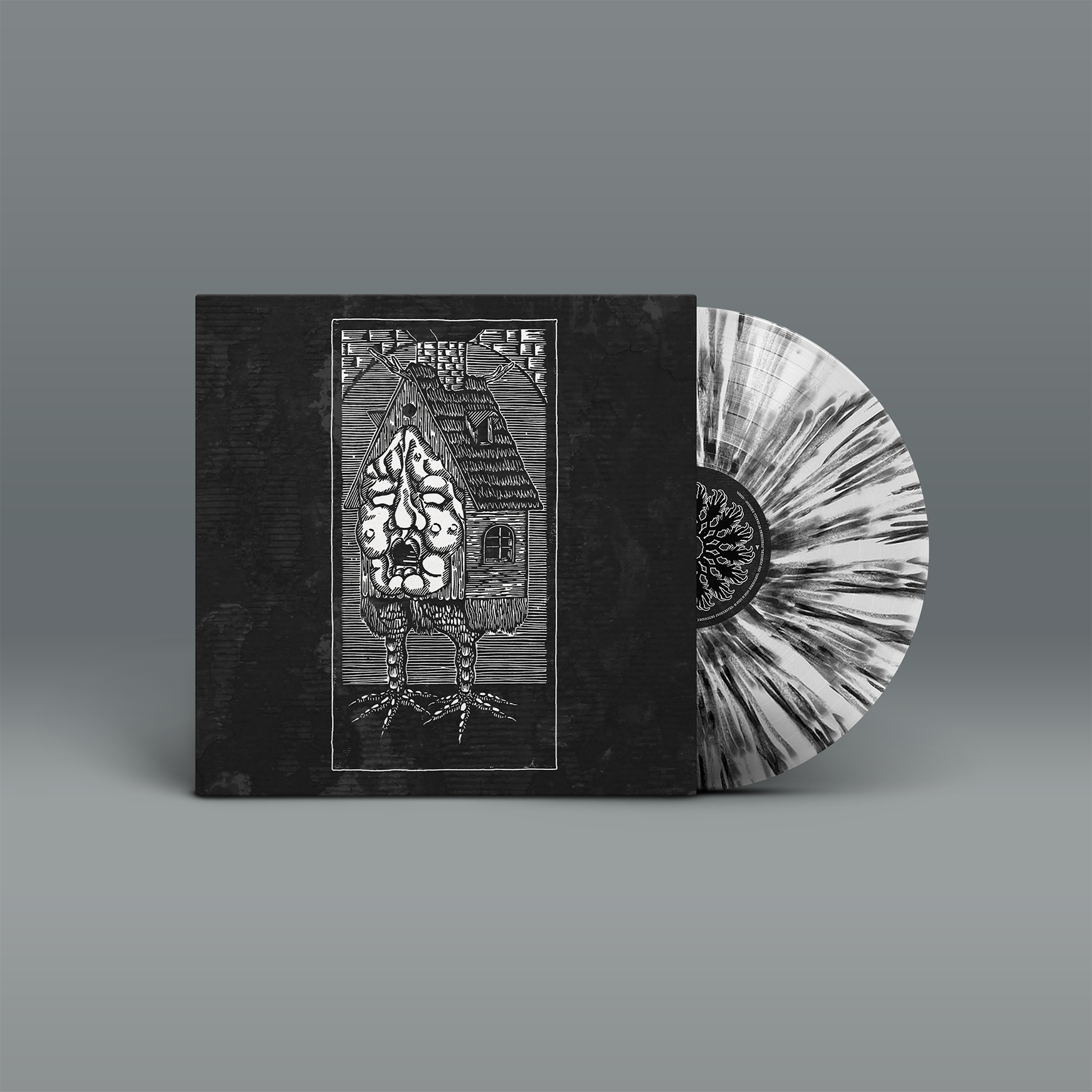 "Asbest" von "Nekrodeus" auf Vinyl. Schwarzes Cover mit weißes Motiv, schwarz-weiße Splatter-Schallplatte.