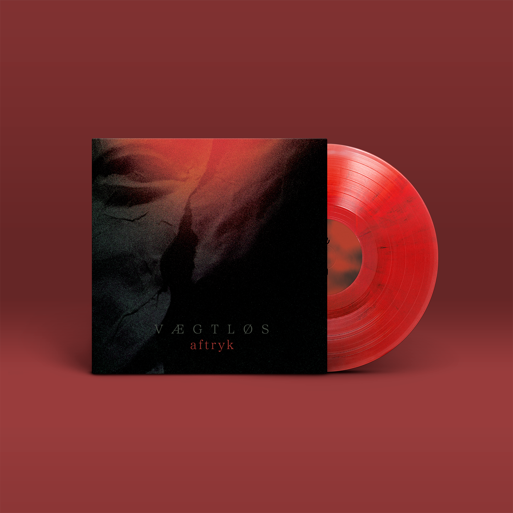 "Aftryk" von "Vægtløs" auf Vinyl. Schwarz-rot-graues Cover, rote Schallplatte.