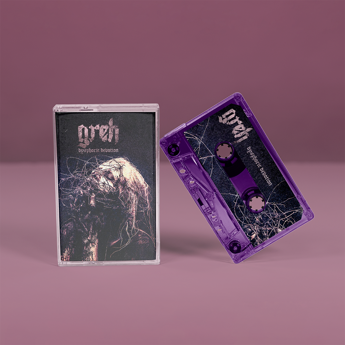 "Dysphoric Devotion" von "Greh" auf Tape. Schwarz-graues Cover, transparent-lila Tape.